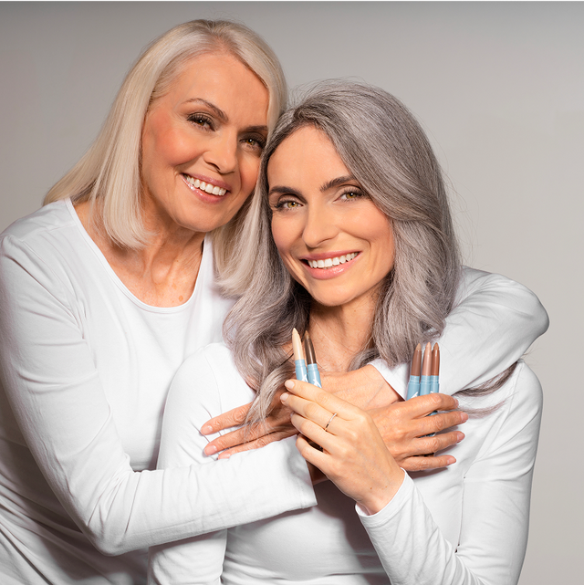 Two women embracing closely.