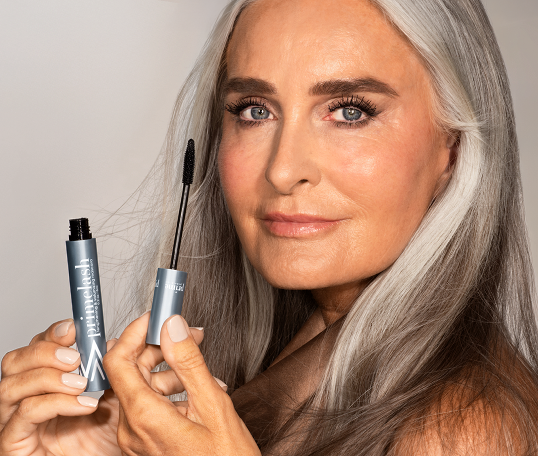 Woman applying pro-age mascara