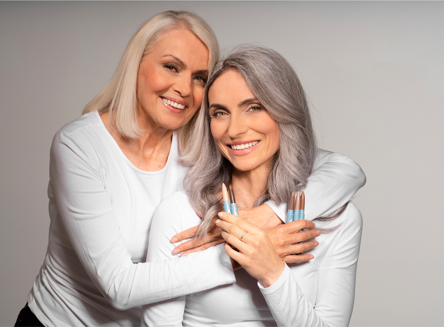 Two women embracing closely.