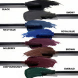 Six PrimeLash Mascara brushes display swipes of vibrant color—Black, Navy Blue, Mulberry, Deep Burgundy, Smoky, Royal Blue, Brown, and Emerald—each clearly labeled by name. Background is white.