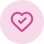 A pink check mark inside a heart shape, centered on a light pink circular background.